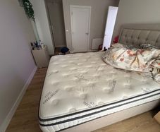 2 year old King size Mattress almost like new no stains with topper already