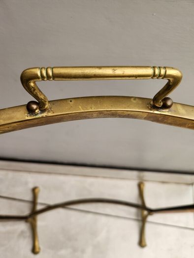 Vintage leaded glass with curved brass screen .