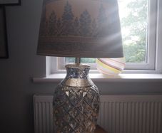 A contemporary mercury glass lamp
