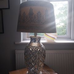 A contemporary mercury glass lamp