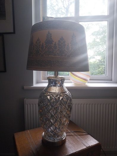 A contemporary mercury glass lamp