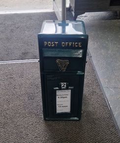 New cast iron green post box