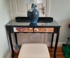 Console table with glass top and matching stool.