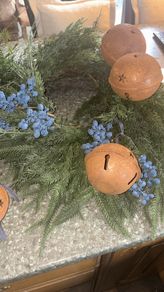 Large fir and small fir blueberries wreaths with a selection of rustic bells and ribbons