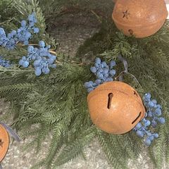 Large fir and small fir blueberries wreaths with a selection of rustic bells and ribbons