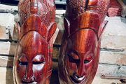 Two carved tribal masks