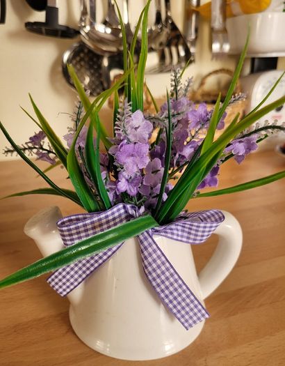 Artifical flowers in jug