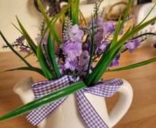 Artifical flowers in jug