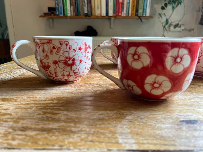 Four decorative cups