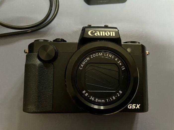 canon G5x complete in box as new. Only set up but never used . Spare camera