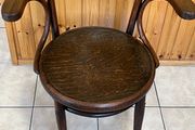 Antique large seated bentwood arm chair