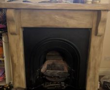 Fireplace surround and cast iron insert