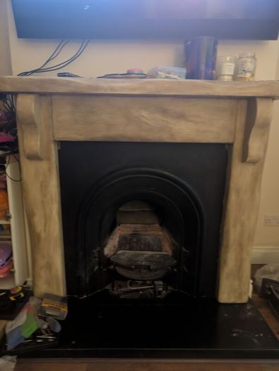 Fireplace surround and cast iron insert