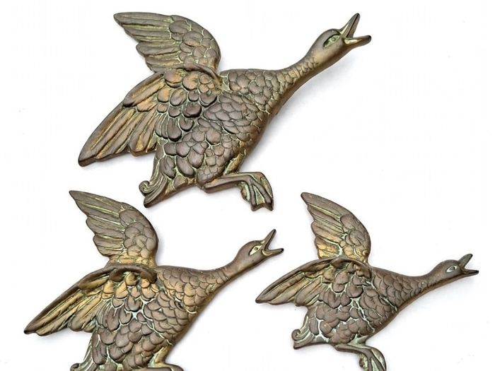 Set of three brass flying ducks