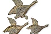 Set of three brass flying ducks