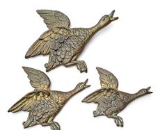 Set of three brass flying ducks