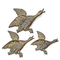 Set of three brass flying ducks