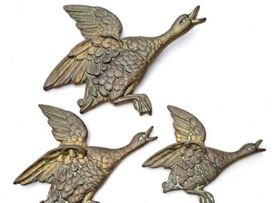 Set of three brass flying ducks