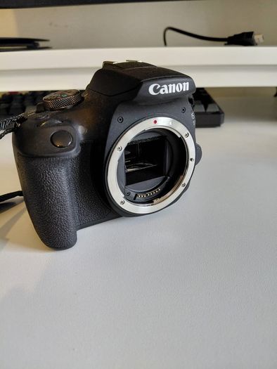Canon 2000D with 18-55mm lens and bag