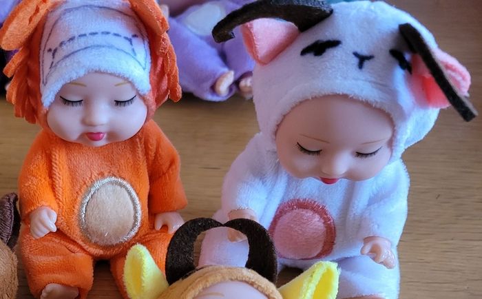 Mini baby dolls in sweet outfits