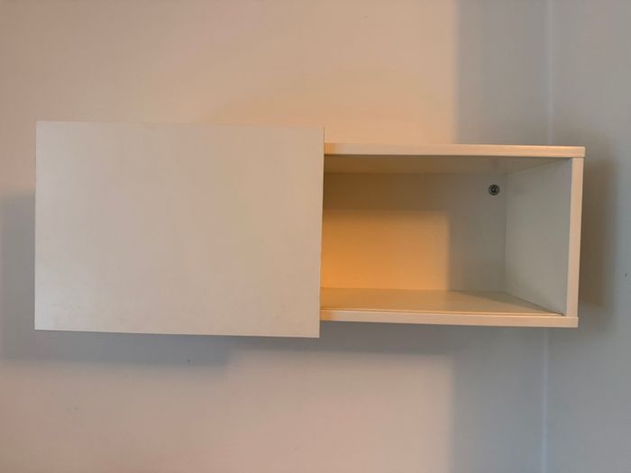 IKEA wall shelf with sliding door