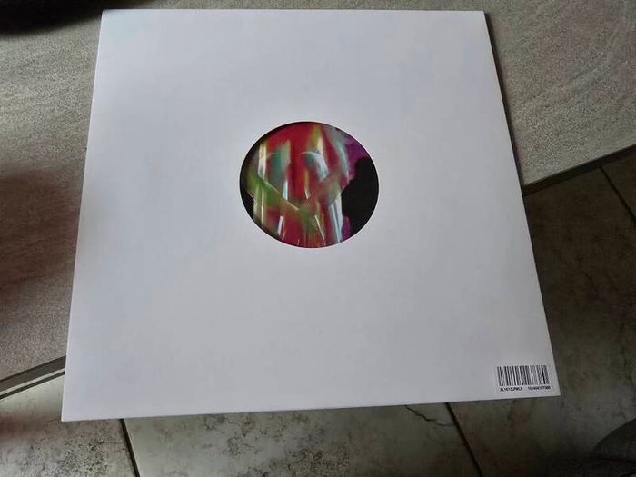 This product is a first pressing of Fontaines DC's album "Dopamine Chamber" on white vinyl in a cardboard sleeve. The record is in mint condition and features stereo audio channels. This limited edition LP was released in 2026