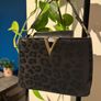 Black leopard print handbag with gold hardware Image 3