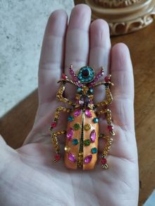 Beautiful brooch in the form of a large beetle with enamel and rhinestones.