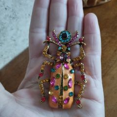 Beautiful brooch in the form of a large beetle with enamel and rhinestones.