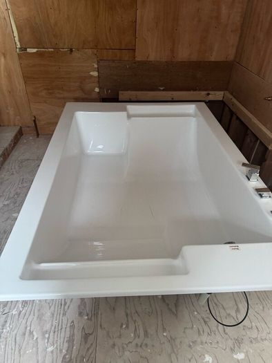Brand new two person bath with fittings