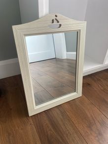 Mirror with boat detail