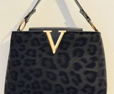 Black leopard print handbag with gold hardware