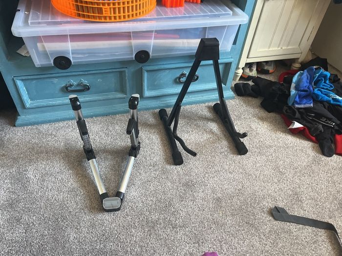 2 guitars with covers and two stand