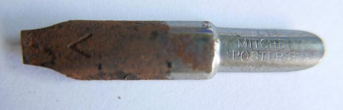 Vintage dip pen with collection of assorted nibs