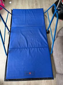 Gymnastics bar and mat for child up to age 8.