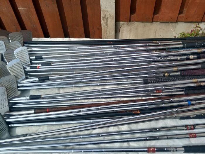 A selection of golf clubs and bags. Golf balls