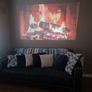 philips neopix ultra 2tv+ home projector and height adjustable stand, built in speakers and android TV with play store stand comes with power point bracket on it as seen in pictures also remote and phone holder Image 4