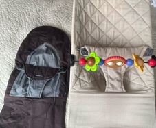 Beige baby bjorn bouncer with toy bar and spare cover
