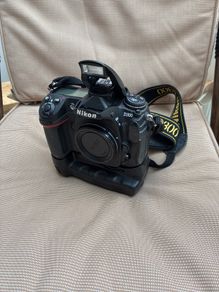 Nikon D300, barely used. Bag and accessories: Li-ion Battery Pack; Charger; 4 GB cards x2; Hahnel Infrapro Remote; Battery Grip; User's Manual; Lowpro Camera Bag.
