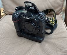 Nikon D300, barely used. Bag and accessories: Li-ion Battery Pack; Charger; 4 GB cards x2; Hahnel Infrapro Remote; Battery Grip; User's Manual; Lowpro Camera Bag.