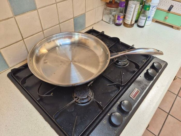 Large stainless steel frying pan