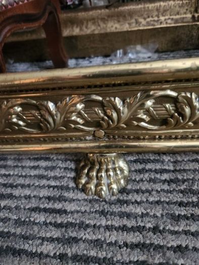19 th Cent fender on claw feet. Polished