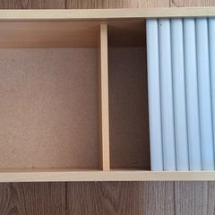 Wall mounted DVD shelf