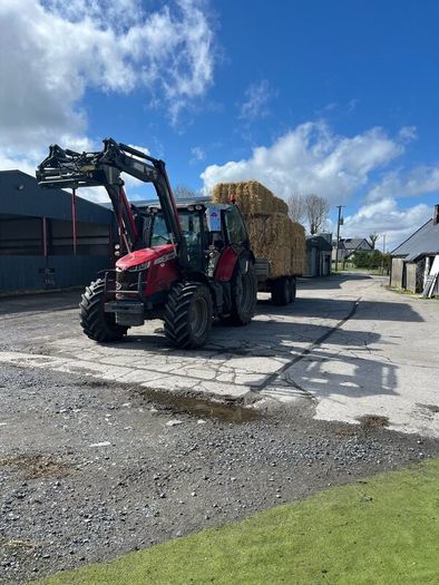 Hauling bales and stacking