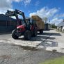 Hauling bales and stacking Image 3
