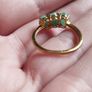 A trilogy ring for women with emeralds and 925 sterling silver in gold plated,TJC.. Image 4