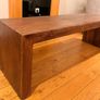 Large, sturdy solid wood coffee table or TV bench in a dark wood finish. Image 2