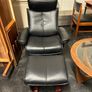 Pair of leather style armchairs with matching footstools Image 3