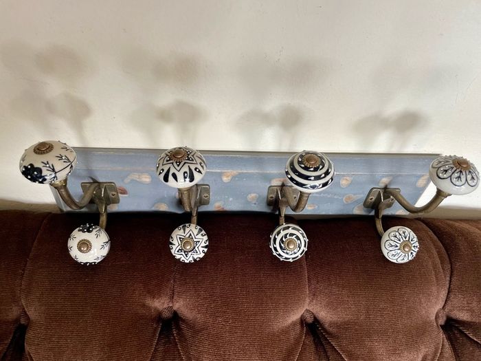 New Unused Stylish Entryway Mounted Ceramic and Brass Coat Hanger