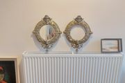 Stunning Pair of Antique Highly Detailed Rococo/Late Baroque Solid Cast Brass Round Mirror Frames with Cherubs Head, Satyr, Flowers and Foliage, One with Mirror and One Without Mirror, Circa 19th Century